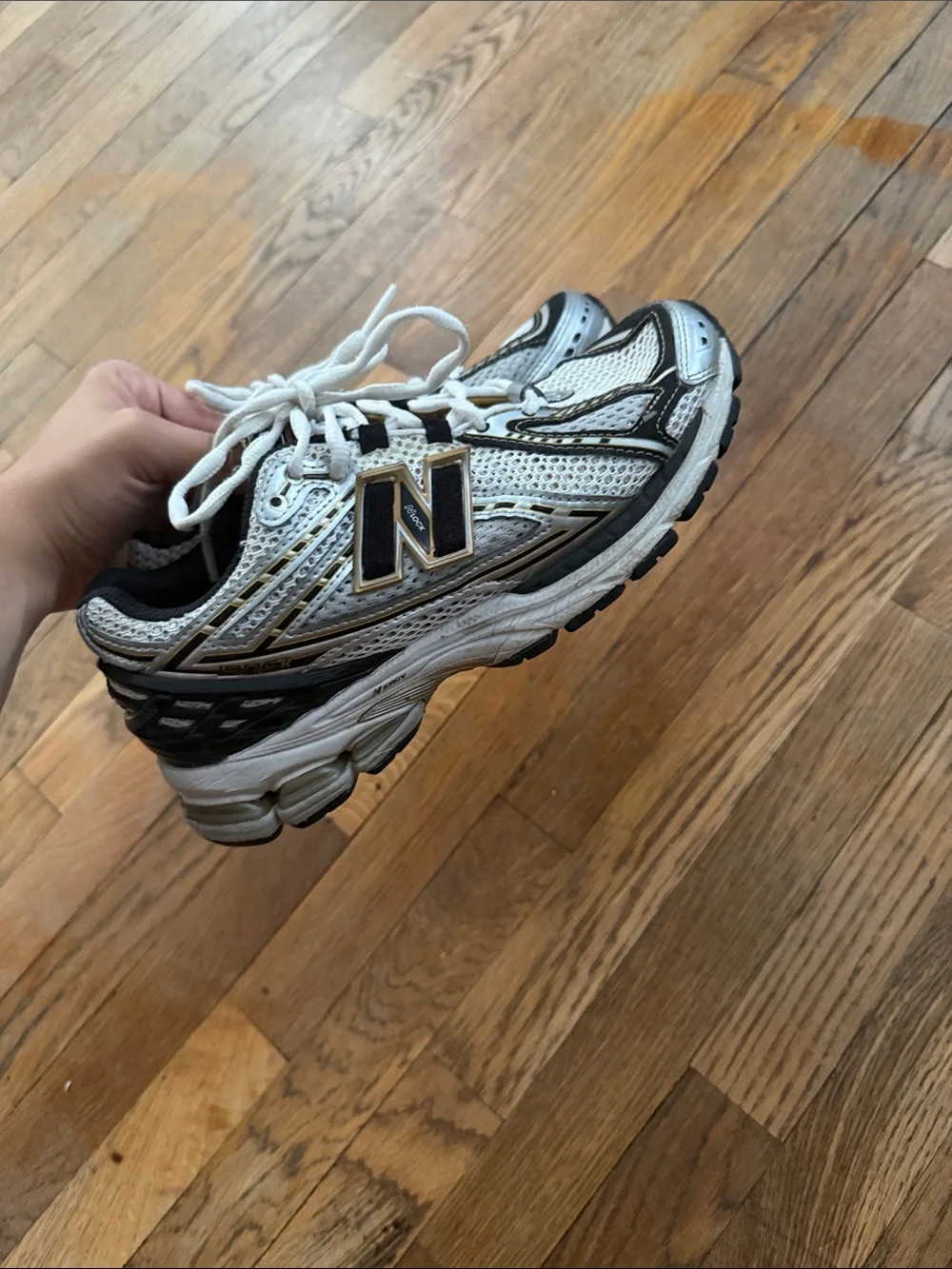 New Balance White Sneakers with Black and Gold Accents